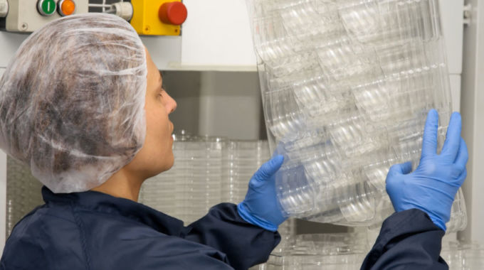 Technician In Clean Room Inspecting Plastic Package Details